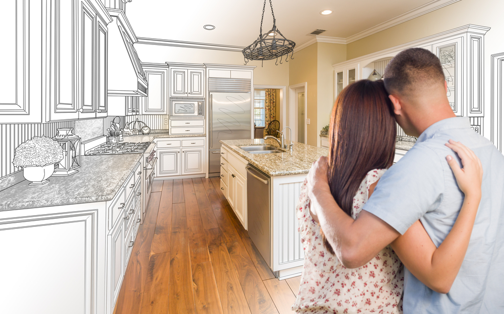 couple looking at an illustrated kitchen